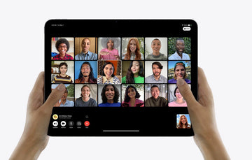 A pair of hands holding an iPad Pro showcasi